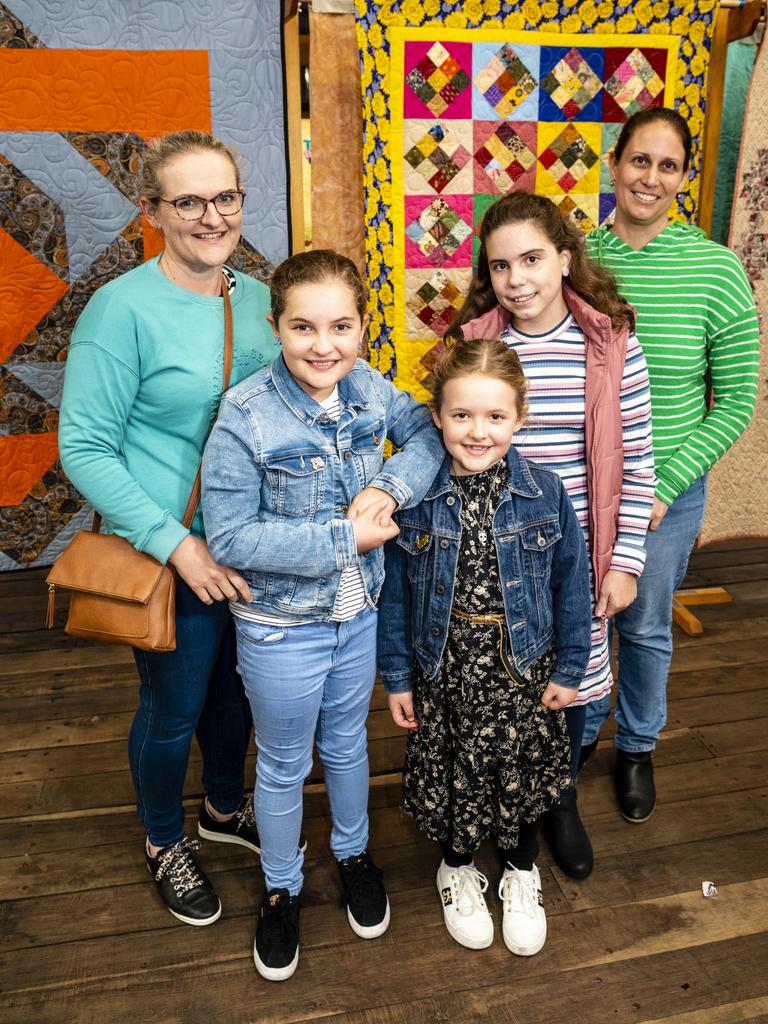 Checking out the Toowoomba Quilters Club exhibition are (from left) Brittany Ehrich, Ruby Ehrich, Addison Ehrich, Lucy Rodgers and Amanda Rodgers at Craft Alive at the Goods Shed, Sunday, May 22, 2022. Picture: Kevin Farmer