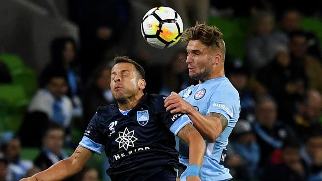 Melbourne City’s Bart Schenkeveld (right) and Sydney FC’s Bobo compete for the ball on Friday night.