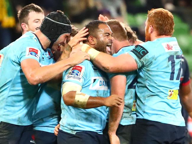 Waratahs players celebrate their win over the Rebels on Friday night. Picture: Getty Images