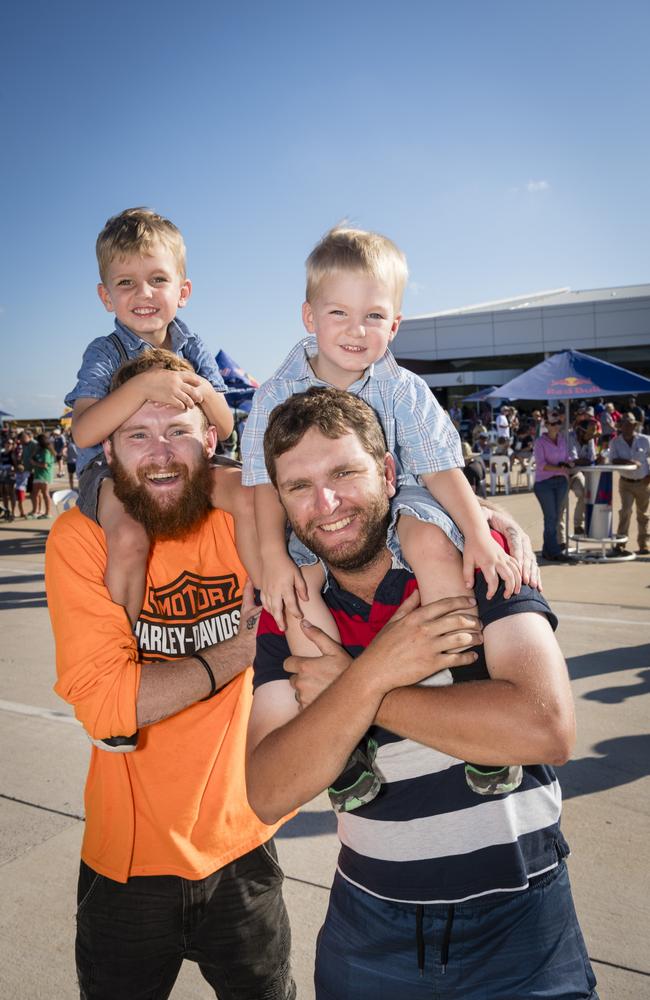 Xavier Smith gets a lift from Jordan Curren (left) and Luca Smith on the shoulders of dad Russell Smith as V8 Supercars team Red Bull Ampol Racing launch their 2024 livery at Toowoomba Wellcamp Airport, Saturday, February 3, 2024. Picture: Kevin Farmer