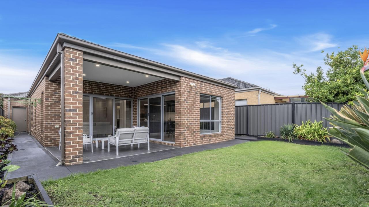 Manicured lawns and a covered entertaining space create a low-maintenance backyard retreat in Craigieburn.