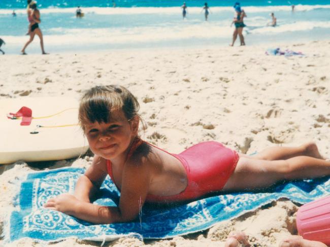 Happy days … growing up at Maroubra, in Sydney, Warner spent much of her time on the beach. Picture: Family Archive.