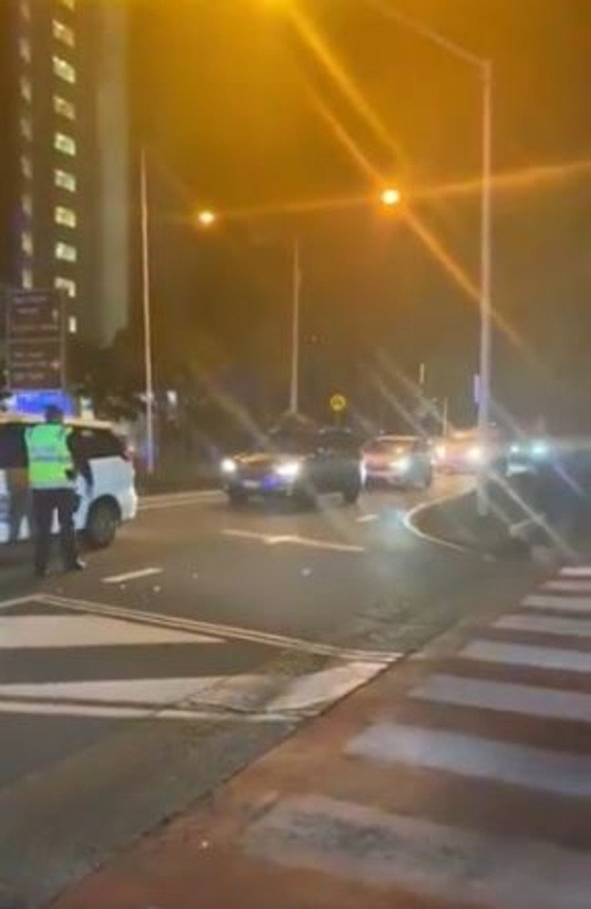 Cars have lined up on the Queensland border at Coolangatta after new restrictions came into effect. Picture: 9 News/Jess Millward