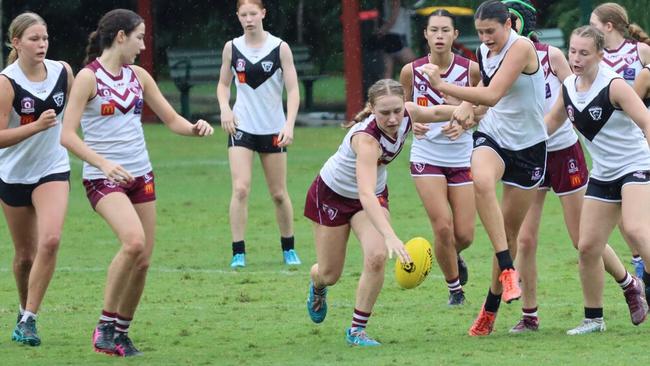 Violet Gleeson of the Wests Juniors has eyes for the ball.