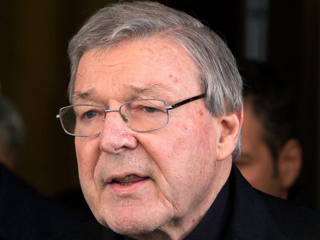 FILE - In this March 3, 2016, file photo, Australian cardinal George Pell reads a statement to reporters as he leaves the Quirinale hotel after meeting members of the Australian group of relatives and victims of priestly sex abuses, in Rome, Italy. A lawyer for the most senior Vatican official ever charged in the Catholic Church sex abuse crisis told an Australian court on Tuesday, April 17, 2018 that Pell could have been targeted with false accusations to punish him for the crimes of other clerics. (AP Photo/Riccardo De Luca, File)