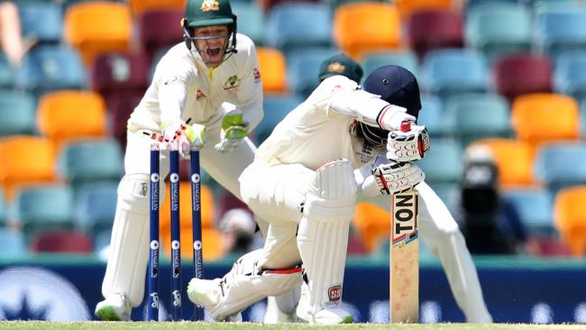 Tim Paine removes the bails to dismiss Moeen Ali on Sunday.