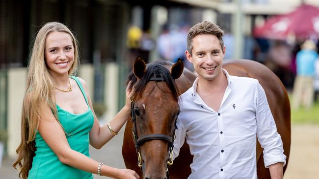 Jamie Piggott, son of famous jockey Lester Piggott and girlfriend Milly Everatt with lot 726 at the Magic Millions sales. Picture by Luke Marsden.