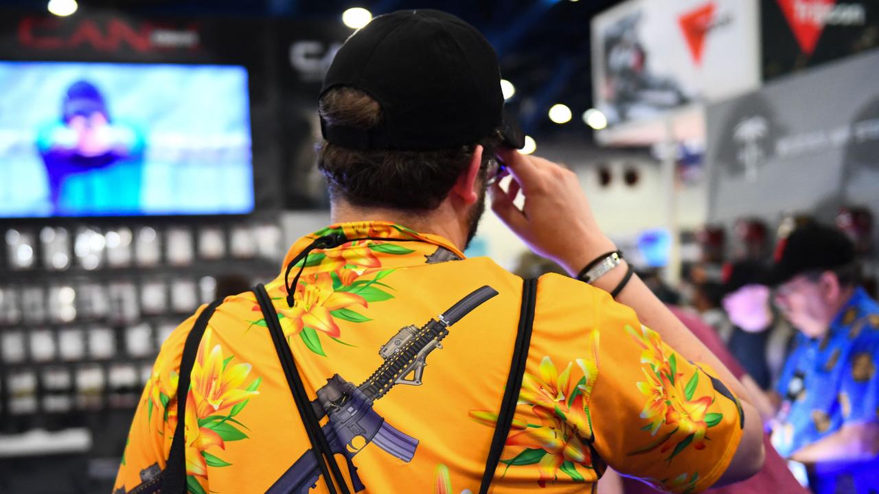 An attendee wears a shirt featuring an AR-15 style rifle during the National Rifle Association (NRA) Annual Meeting in Houston, Texas. Picture: Patrick T. Fallon / AFP