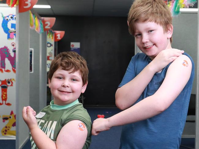 The Cairns and Hinterland Hospital and Health service has opened a new Covid-19 coronavirus vaccination centre at The Pier Shopping centre, which specialises in jabs for children aged 5 to 16. Olly Ellison, 5, and his brother Alex Ellison, 10, were vaccinated against Covid-19 at the new clinic while holidaying with their family from Melbourne. Picture: Brendan Radke