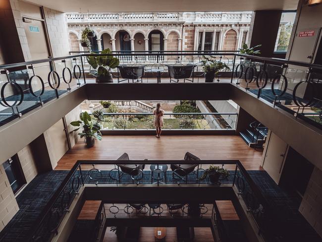 The view of the older section of the Lenna of Hobart from the modern extension offers a stunning view of the original sandstone building's imposing terraces.