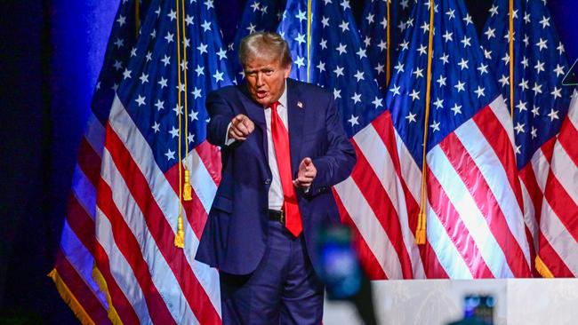 Former US President and 2024 Republican presidential hopeful Donald Trump gestures at the end of a campaign event at Club 47 USA in West Palm Beach, Florida, on October 11, 2023. (Photo by GIORGIO VIERA / AFP)