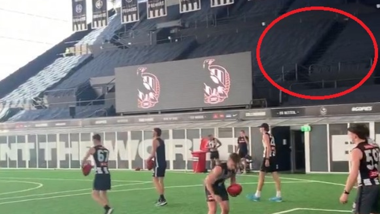Collingwood AFL players training on what was a netball facility.