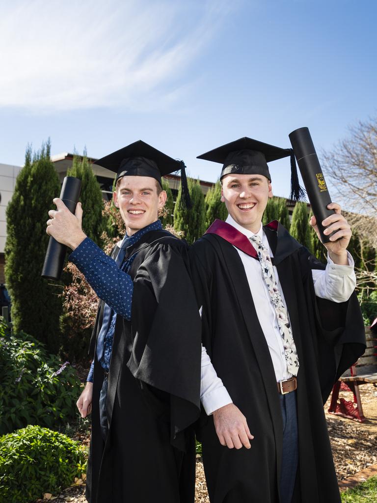 College mates originally from Warwick William Jamieson (left), graduating with a Bachelor of Creative Arts (Music), and Mitch Hay, graduating with a Bachelor of Urban and Regional Planning, at a UniSQ graduation ceremony at Empire Theatres, Wednesday, June 28, 2023. Picture: Kevin Farmer