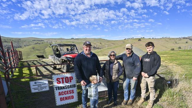 Dave Purcell, his little boy Sam, Louise Purcell, Geoff Purcell and Angus Purcell on their property in Batlow. Picture: Martin Ollman