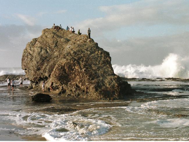 1999: People on Currumbin rock getting good view of wild seas pounding the coast.