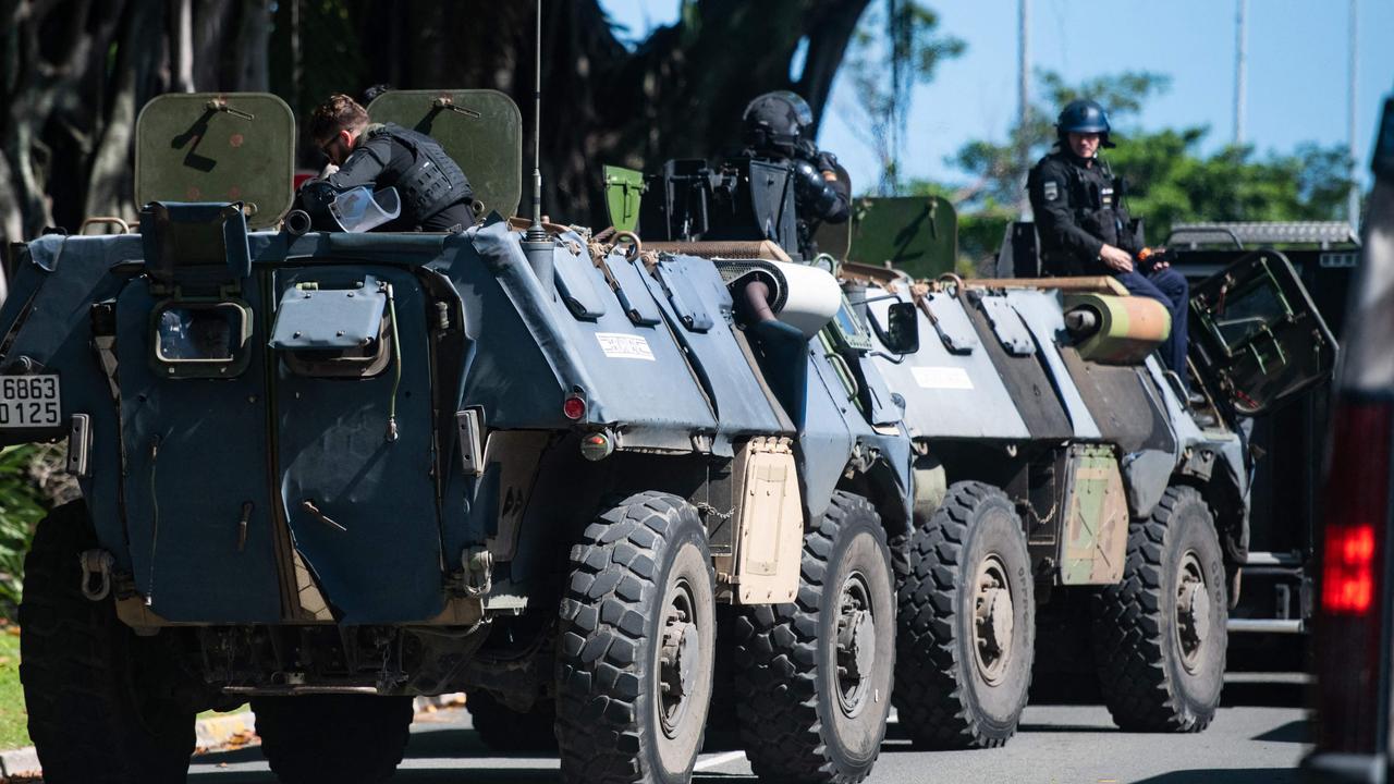 Gendarmerie armoured vehicles are seen near a police station in Noumea, France's Pacific territory of New Caledonia, on May 18, 2024. Hundreds of French security personnel tried to restore order in the Pacific island territory of New Caledonia on May 18, after a fifth night of riots, looting and unrest. (Photo by Delphine Mayeur / AFP)