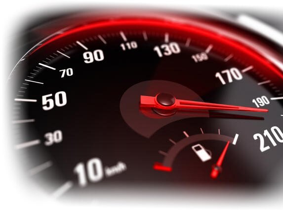 Close up of a car speedometer with the needle pointing a high speed, blur effect, conceptual image for excessive speeding or careless driving concept