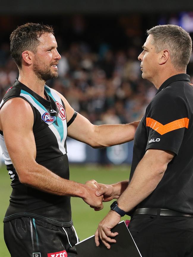 Travis Boak and GWS coach Adam Kingsley after the game. Picture: Sarah Reed/AFL Photos