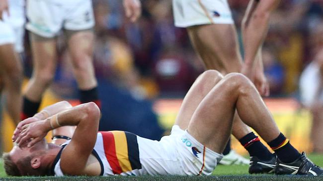 Crows players react after the siren in the one-point loss to Brisbane. Picture: Jono Searle/AFL Photos/Getty Images