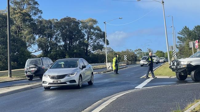 Police diverting traffic around the crash scene. Picture: Jack Colantuono