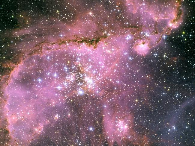 This Hubble Space Telescope view shows one of the most dynamic and intricately detailed star-forming regions in space, located 210,000 light-years away in the Small Magellanic cloud (SMC), a satellite galaxy of our Milky Way.