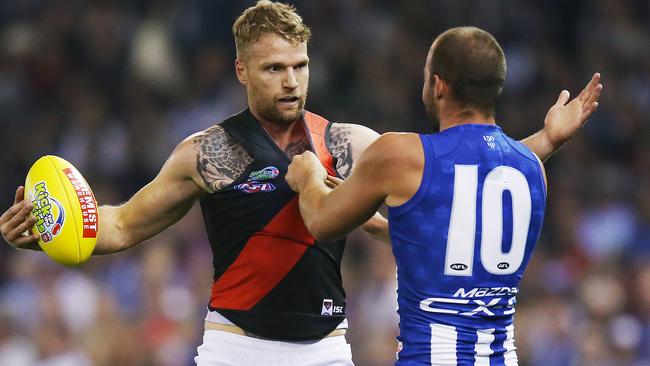 Ben Cunnington grabs Jake Stringer’s jumper in Round 5 at Marvel Stadium, a match which the Bombers won by 58 points. Picture: Getty Images