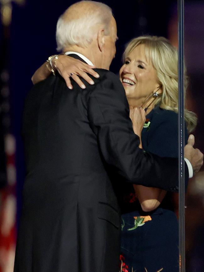 Jill Biden and her husband, US President-elect Joe Biden, hug on stage after Biden's address to the nation. Picture: Tasos Katopodis/Getty Images