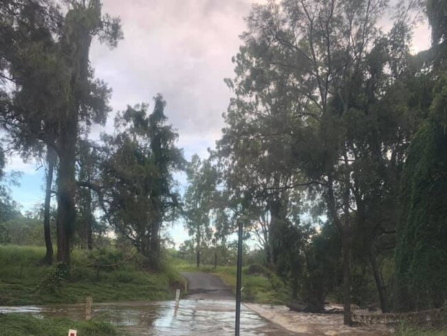 A flooded crossing at Glastonbury Creek where 90mm fell overnight, stopped residents from passing. Photo: Casey Turner