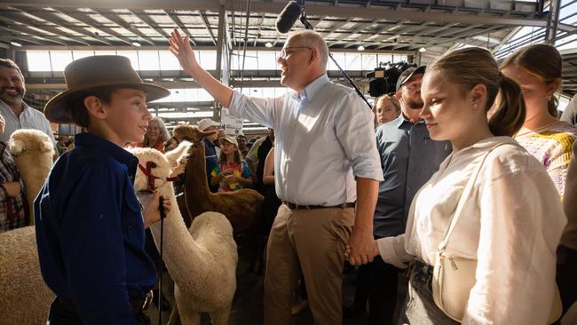 A young man meets Mr Morrison’s daughters. Picture: Jason Edwards