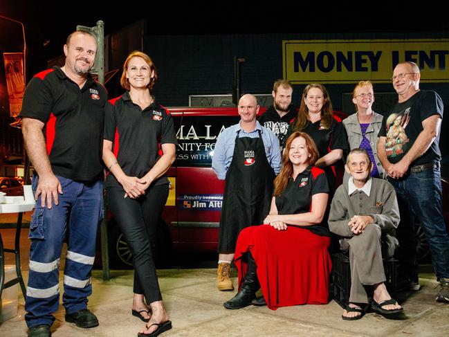 Lana and husband Roger pictured with some volunteers and patrons in Penrith. Picture: Jonathan Ng