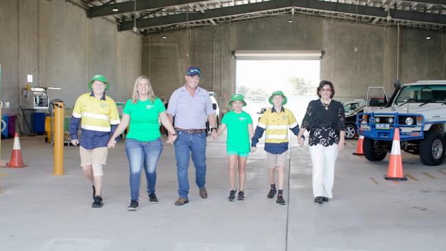 MAMS Group business manager Louise Lannen with her family at their Containers for Change facility. Picture: Supplied.