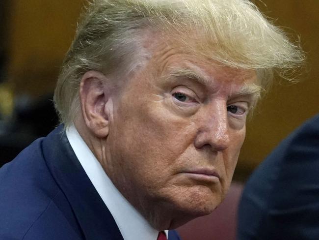 TOPSHOT - Former US president Donald Trump appears in court at the Manhattan Criminal Court in New York on April 4, 2023. - Former US president Donald Trump arrived for a historic court appearance in New York on Tuesday, facing criminal charges that threaten to upend the 2024 White House race. (Photo by Timothy A. CLARY / POOL / AFP)