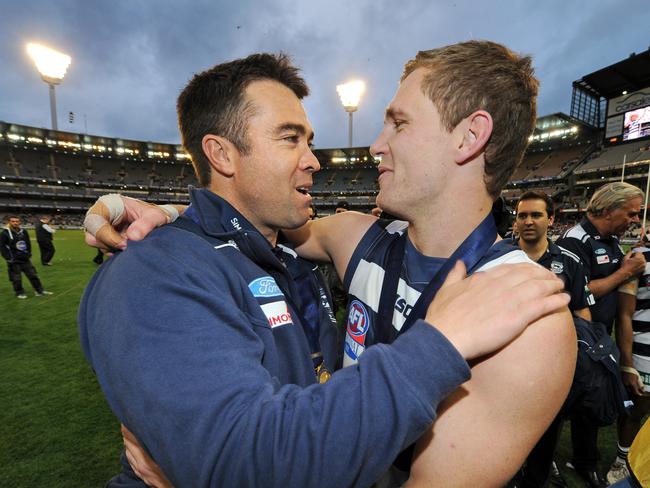 Chris Scott shares a flag memory with Joel Selwood.