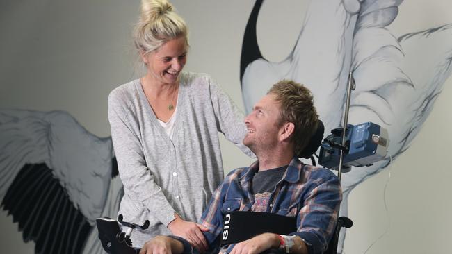 Gold Coaster Robert "Robbo" Croll was badly injured in a freak surfing accident last year and is a borderline quadriplegic. He is moving home with his parents on the Sunshine Coast. Pictured with his wife Katie.