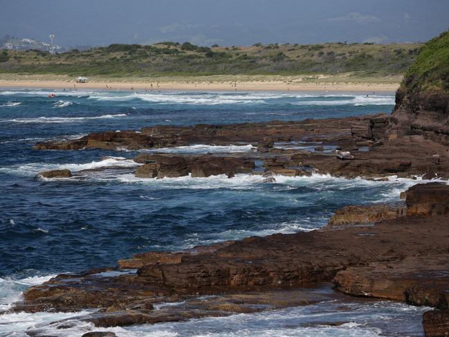 A massive search was launched after five people were swept off rocks. Three people were confirmed dead at the scene. Picture: David Swift