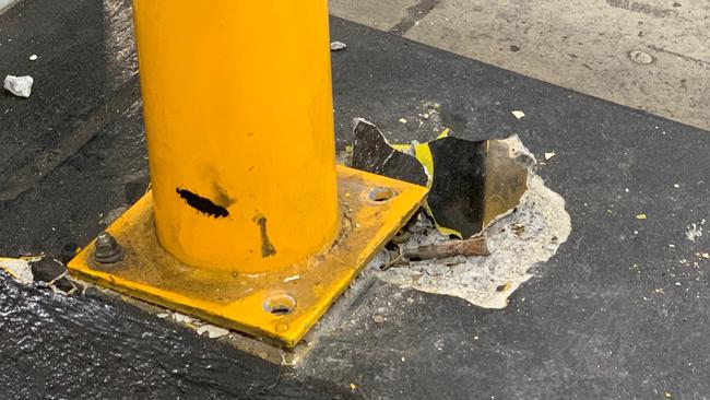 Damage to one of the bollards hit during the incident.