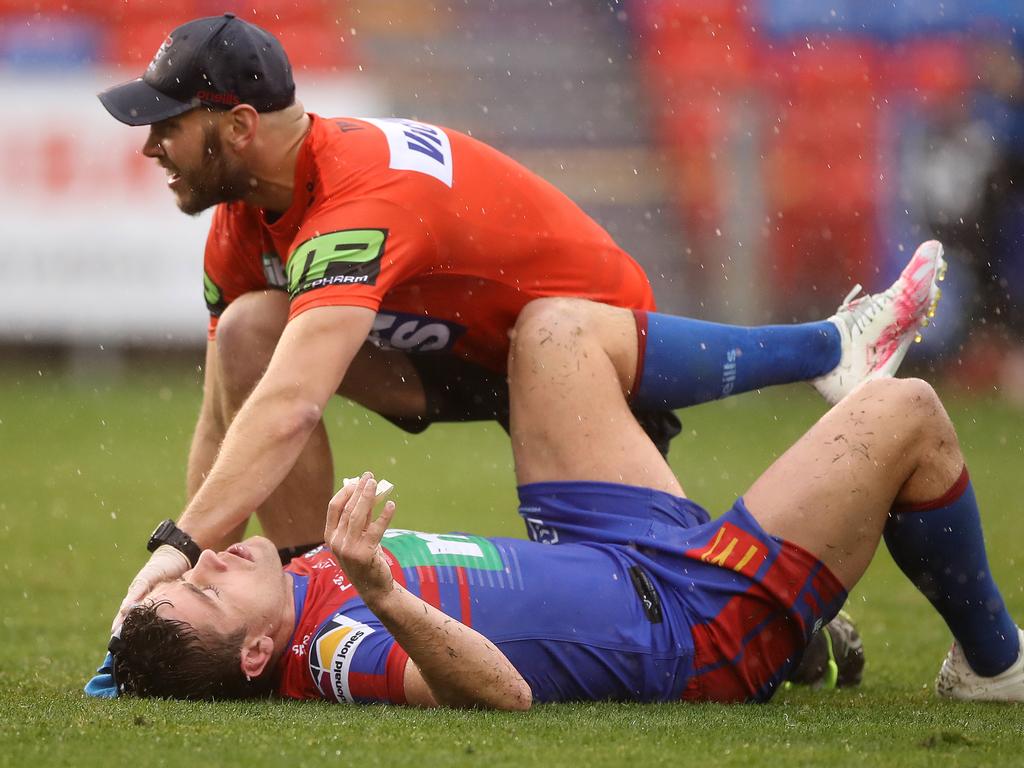 Andrew McCullough is assisted by a medic.