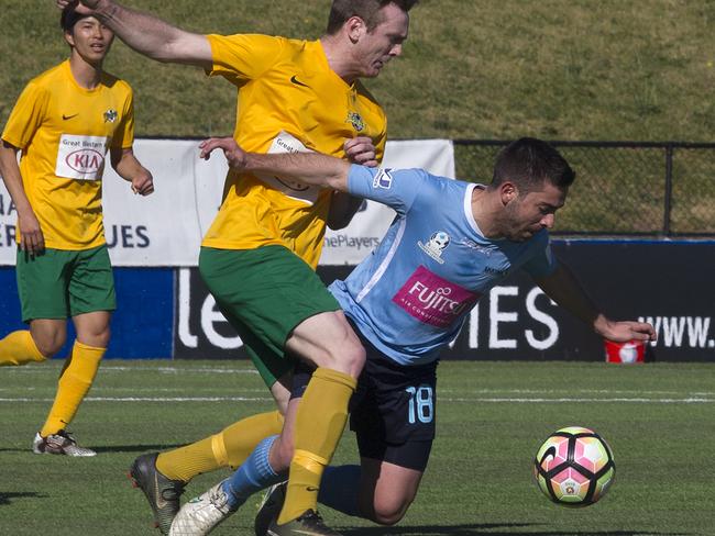 Mt Druitt Town Rangers (yellow/green) as they take on the Marconi Stallions in the National Premier Leagues' 2 NSW men's Grand Final at United Sports Centre in Edensor Park, NSW, Australia, 17 September 2017. (AAP Image/Annika Enderborg(