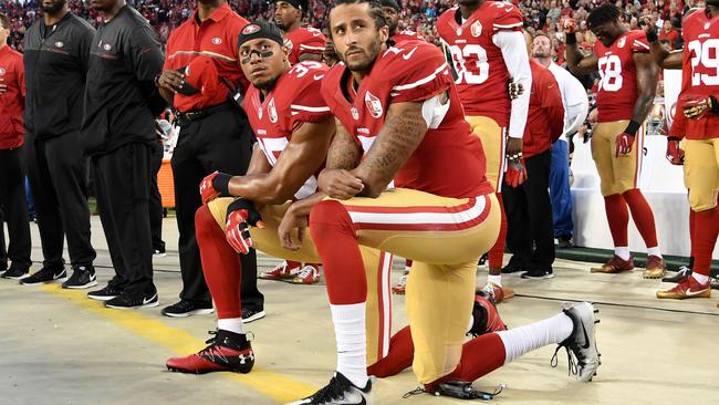 Colin Kaepernick, right, and Eric Reid of the San Francisco 49ers kneel in protest before a game in 2016. Picture: Getty Images