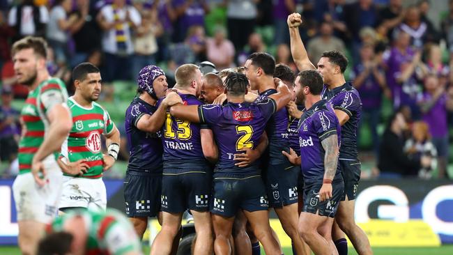 MELBOURNE, AUSTRALIA - MARCH 17: Storm celebrate winning  the round two NRL match between the Melbourne Storm and the South Sydney Rabbitohs at AAMI Park, on March 17, 2022, in Melbourne, Australia. (Photo by Kelly Defina/Getty Images)