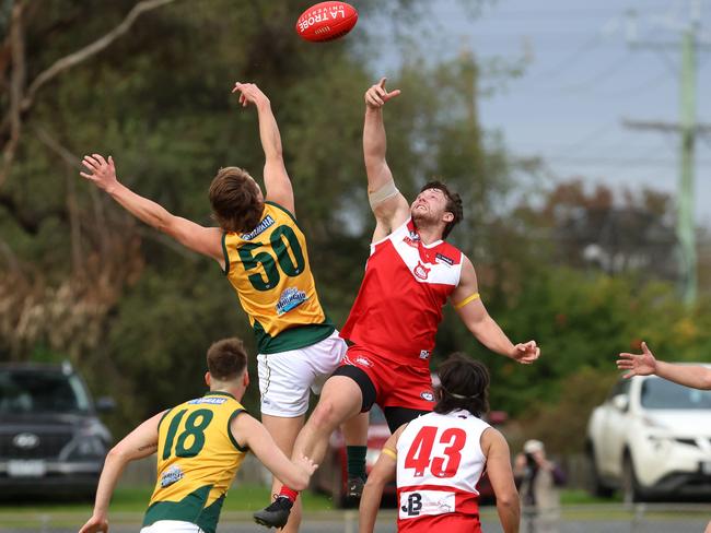 NFNL: Brock Greaves of Kinglake flies against Lalor’s Tom Burn in the ruck. Picture: Hamish Blair