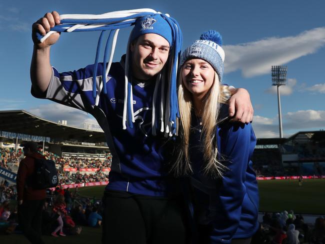 North Melbourne fans Brodie Graesser and partner Emily Tyson made the trip down from Launceston to watch the game. Picture: Nikki Davis-Jones