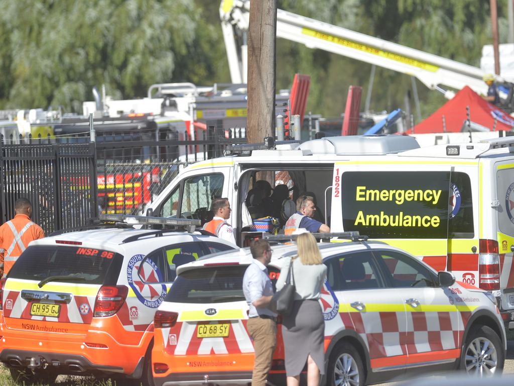 Family and workmates at the scene of where a man was electrocuted in Moorebank. Picture: Jeremy Piper