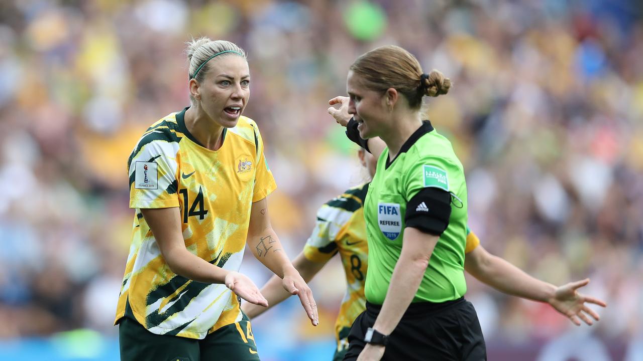 Alanna Kennedy of Australia confronts referee Esther Staubli