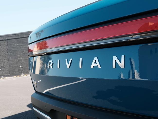 NEW YORK, NEW YORK - NOVEMBER 09: The new all-electric pickup truck by Rivian, the R1T, sits at one of its facilities on November 09, 2021 in the Brooklyn borough of New York City. The company, which makes electric trucks and is backed by Amazon and Ford, has has been valued at $64 billion ahead of its IPO tomorrow.   Spencer Platt/Getty Images/AFP == FOR NEWSPAPERS, INTERNET, TELCOS & TELEVISION USE ONLY ==