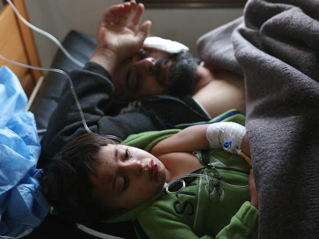 People injured in a reported Syrian regime air strike on the Wadi Khaled camp, also known as Telhadia camp, receive treatment at the SAMS hospital in Maarat Misrin town in Syria's northern Idlib governorate. Picture: AFP