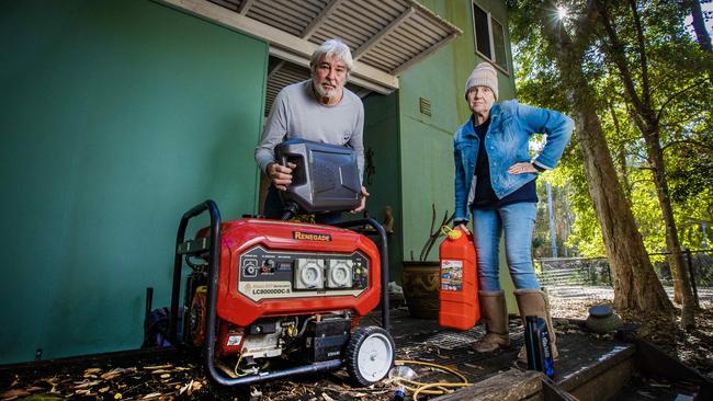 Couran Cove residents Sharon Campione and her partner Mark filling up their generators. Picture: Nigel Hallett