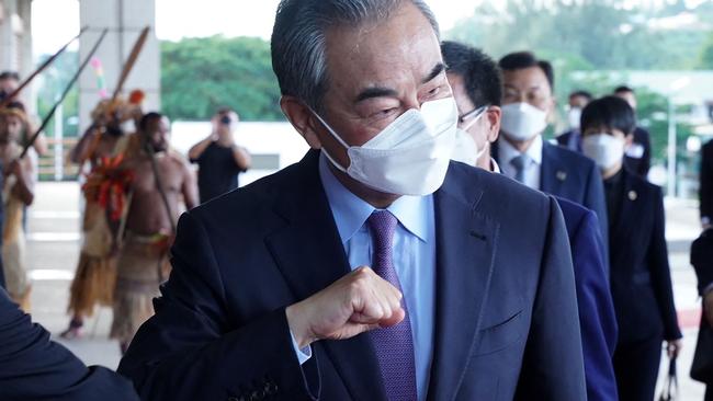 Chinese Foreign Minister Wang Yi greets officials before meeting with Vanuatu President Tallis Obed Moses in Port Vila. Picture: Ginny Stein/AFP