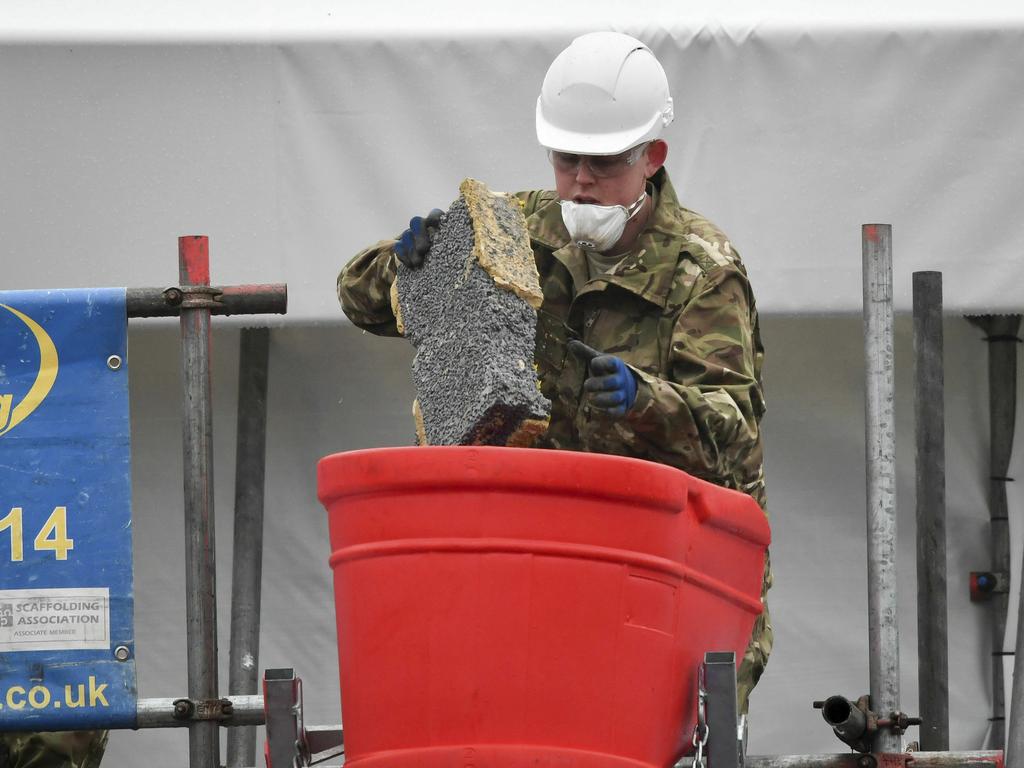 Last week, an army specialist removed bricks and rubble from the home of former Russian Spy Sergei Skripal in Salisbury, England. Picture: AP