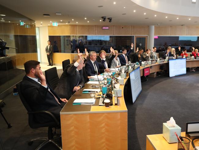 Mayor Tom Tate with the budget books in the chamber,  also councillors voting on the budget, at the Gold Coast City Council Chambers at Evandale . Picture Glenn Hampson